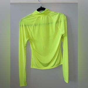 Urban Outfitter’s tight neon green turtle neck. Hardly worn.